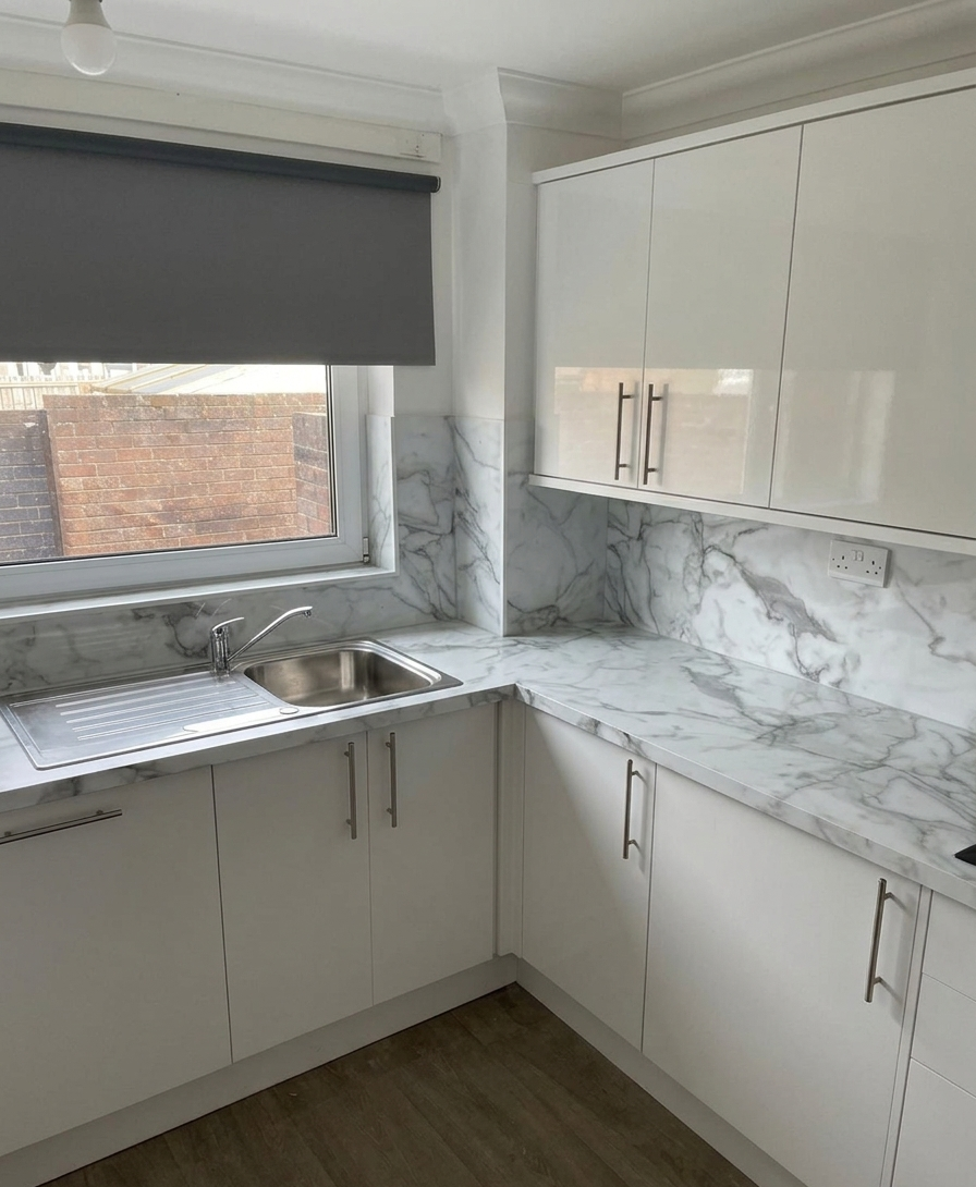 Bespoke fitted kitchen in an Edinburgh home with shaker units and a centre island.