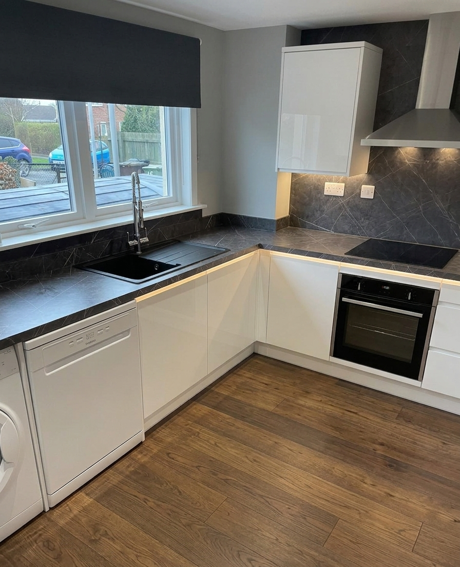 Hand-built fitted kitchen in Edinburgh with painted units and timber accents.